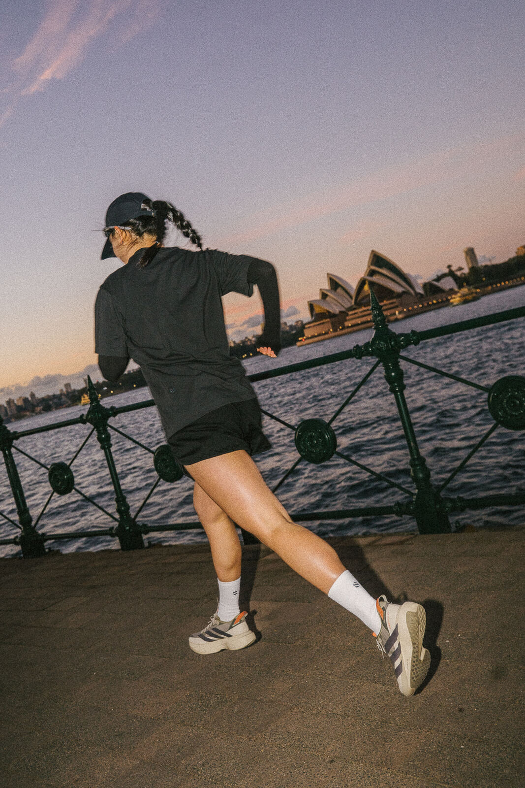 Runner at dusk in front of the Sydney Opera House